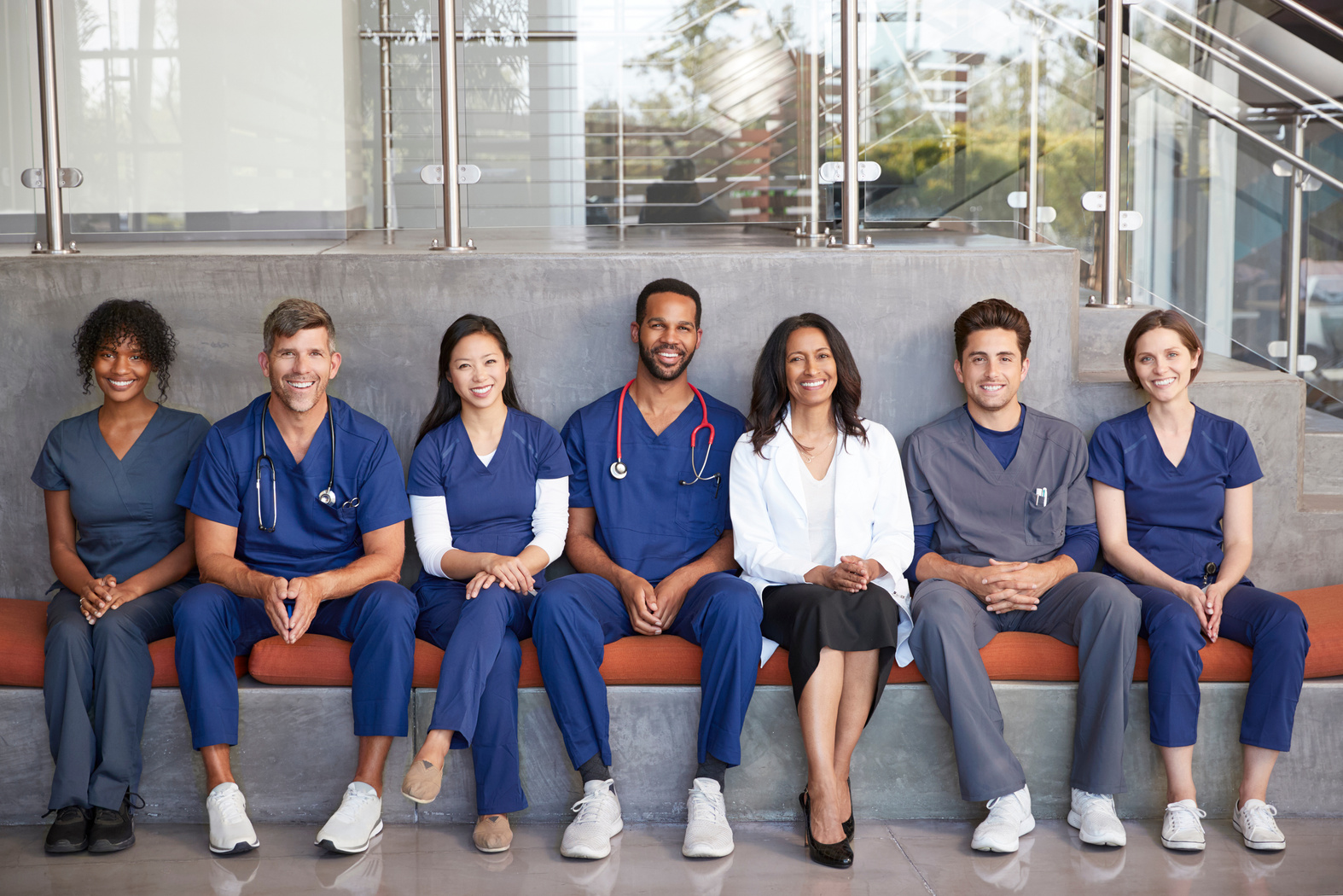 Healthcare Workers Sitting Together in a Modern Hospital